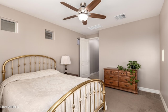 bedroom featuring ceiling fan and carpet