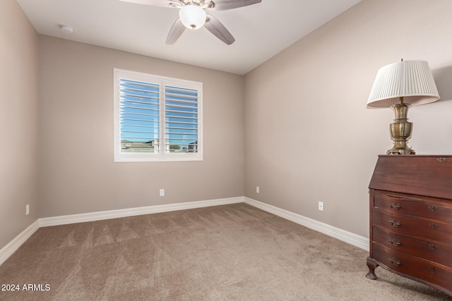 unfurnished bedroom with light carpet and ceiling fan