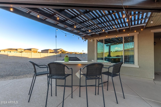 view of patio with a pergola and an outdoor bar