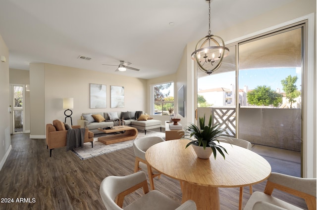 interior space with ceiling fan with notable chandelier