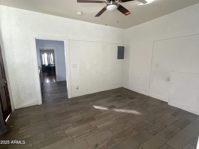 spare room featuring electric panel and ceiling fan