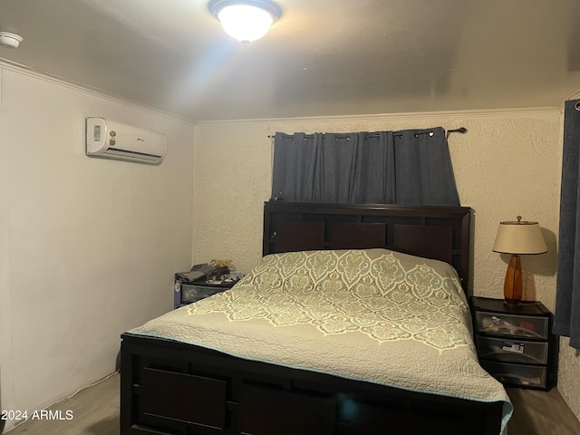 bedroom with a wall mounted AC and ornamental molding