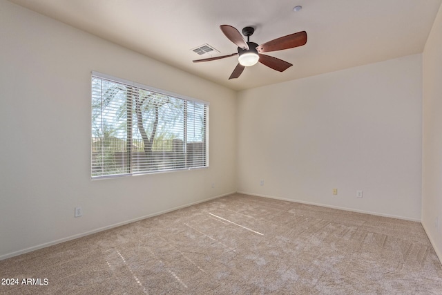 empty room with light carpet and ceiling fan