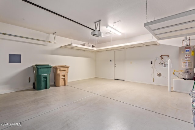 garage featuring a garage door opener and water heater