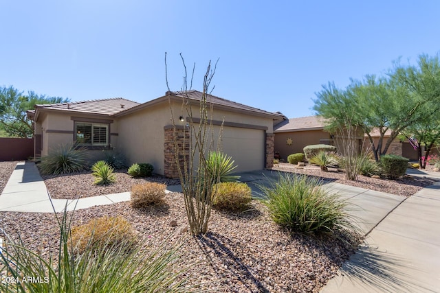 ranch-style house featuring a garage