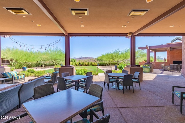 view of patio with a mountain view and an outdoor hangout area