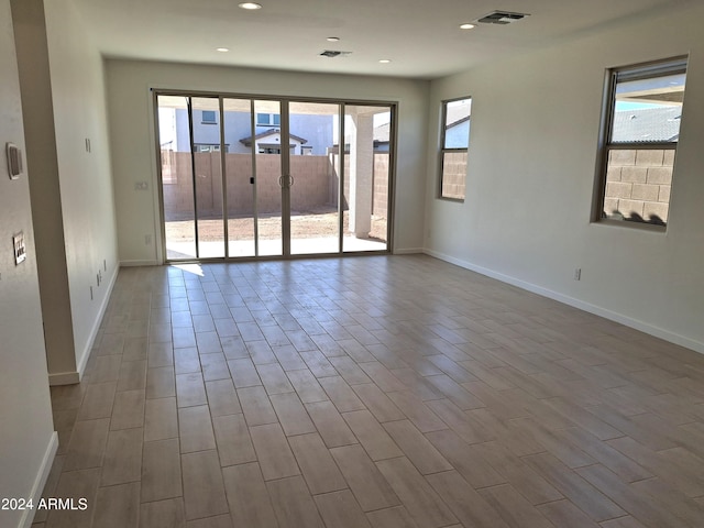 empty room featuring a wealth of natural light