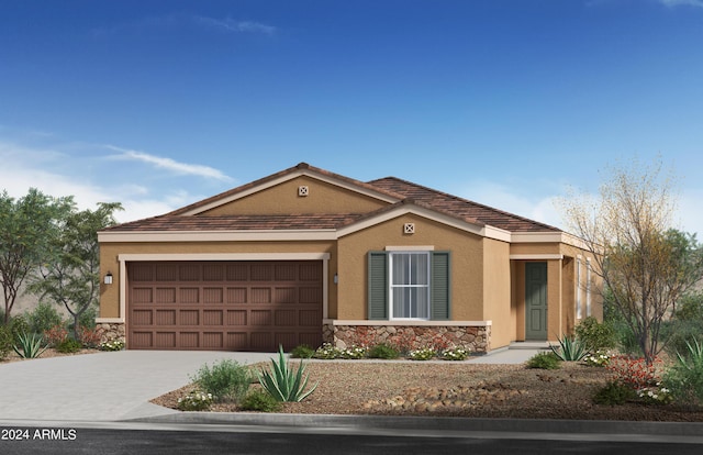 view of front of property with stone siding, driveway, an attached garage, and stucco siding