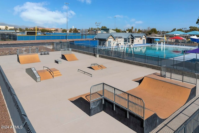 exterior space with fence and a pool