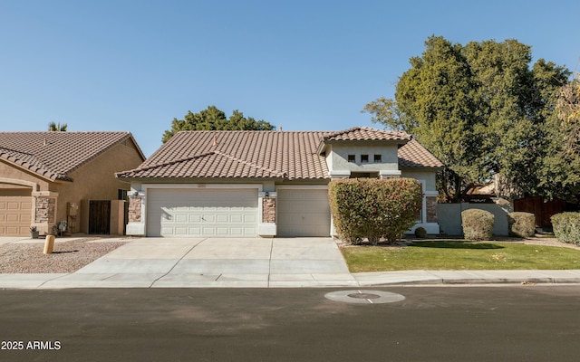 mediterranean / spanish-style home featuring a garage