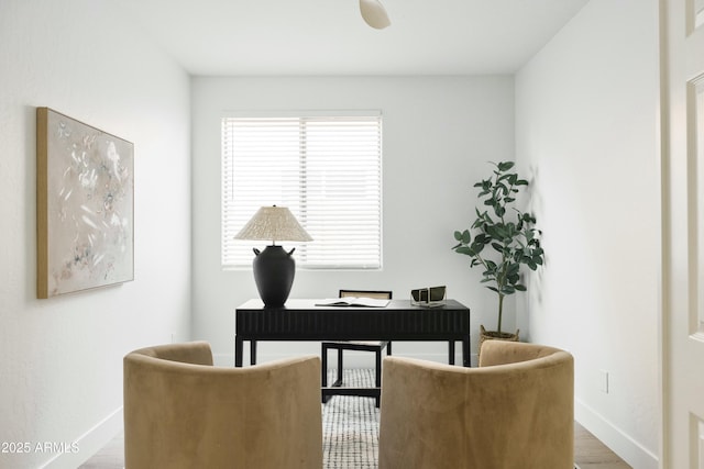 home office with hardwood / wood-style floors and a healthy amount of sunlight