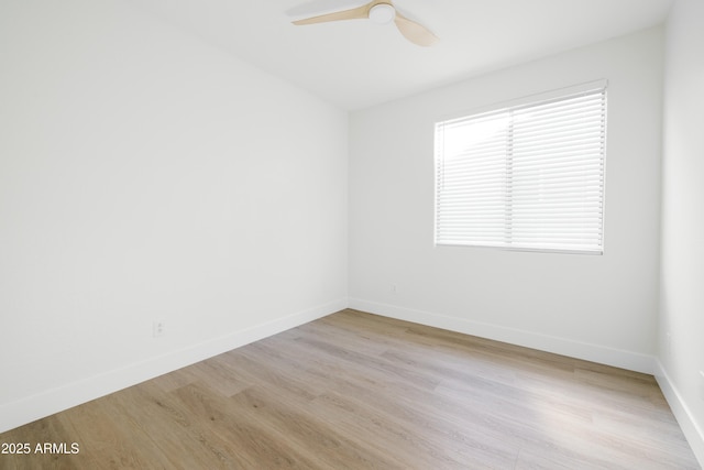 unfurnished room featuring ceiling fan and light hardwood / wood-style flooring