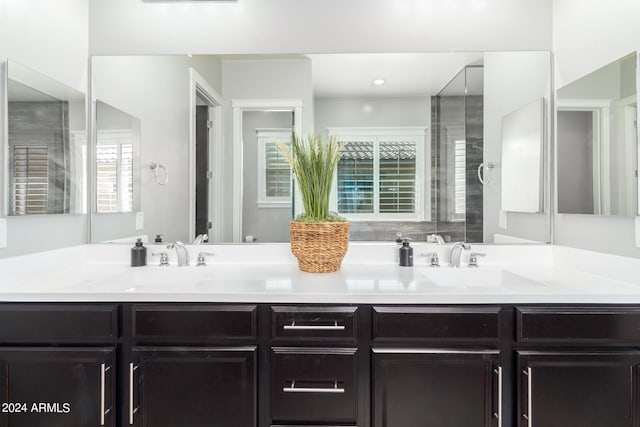 bathroom with vanity and a shower with shower door