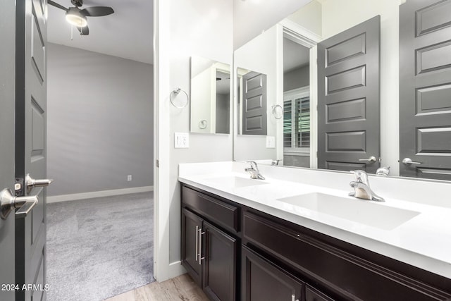 bathroom with ceiling fan, wood-type flooring, and vanity