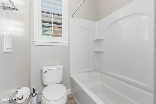 bathroom with toilet and shower / bath combination