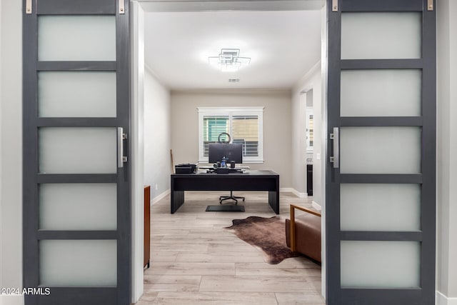 office space featuring wood-type flooring and ornamental molding