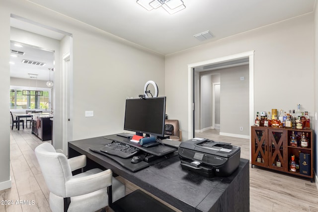 office area with light hardwood / wood-style flooring