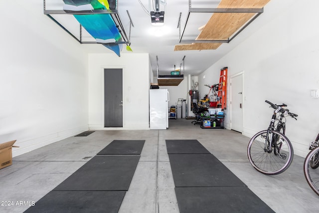 garage featuring a garage door opener and white fridge