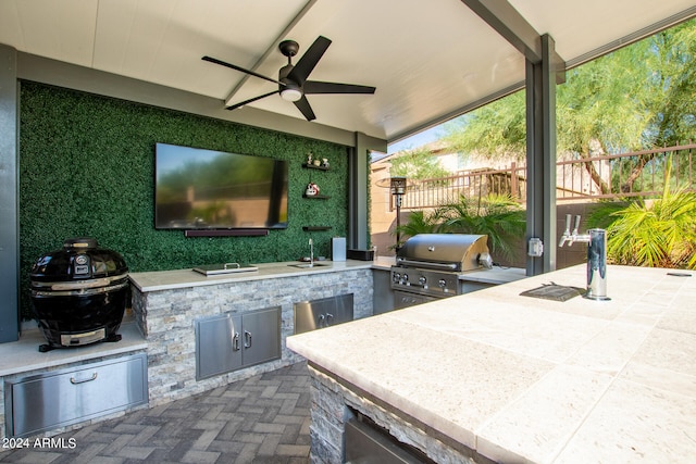 view of patio / terrace featuring area for grilling, ceiling fan, and sink