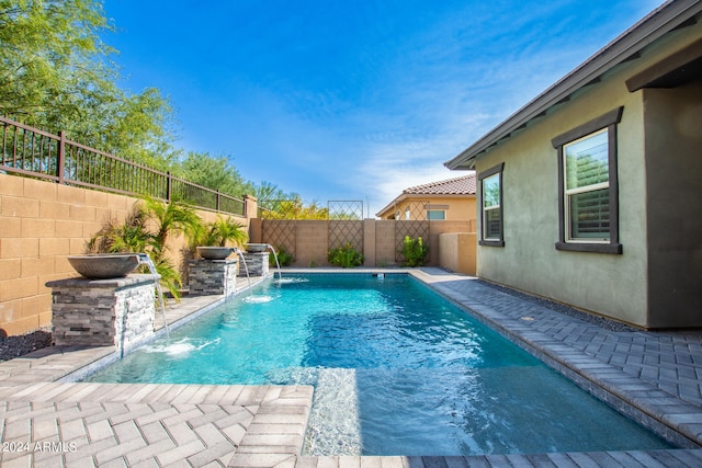 view of pool with pool water feature