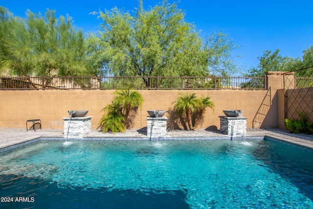 view of pool featuring pool water feature