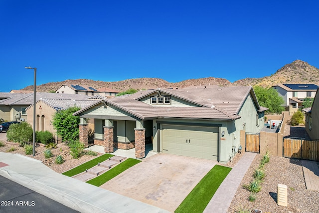 view of front of home featuring a mountain view and a garage