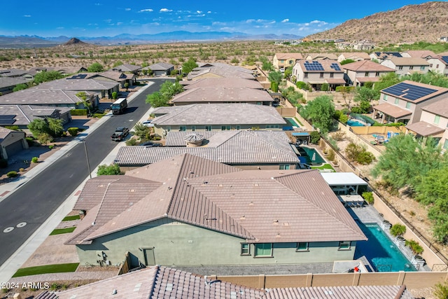 birds eye view of property with a mountain view