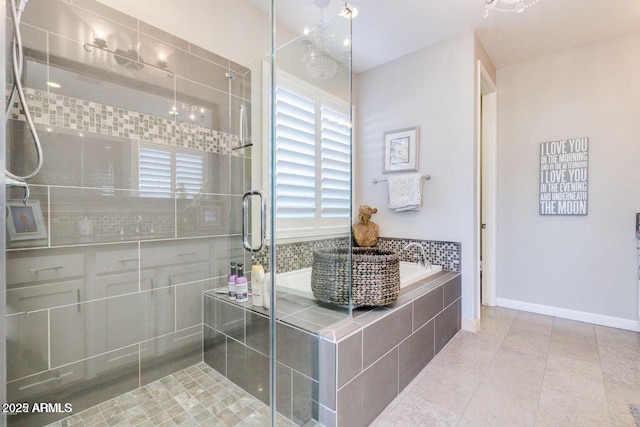 1952 W Yellowstone Way, Chandler, AZ 85248 - bathroom featuring a bath, a shower stall, tile patterned floors, and baseboards
