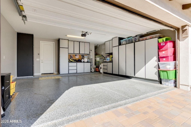 1952 W Yellowstone Way, Chandler, AZ 85248 - garage with a garage door opener and baseboards
