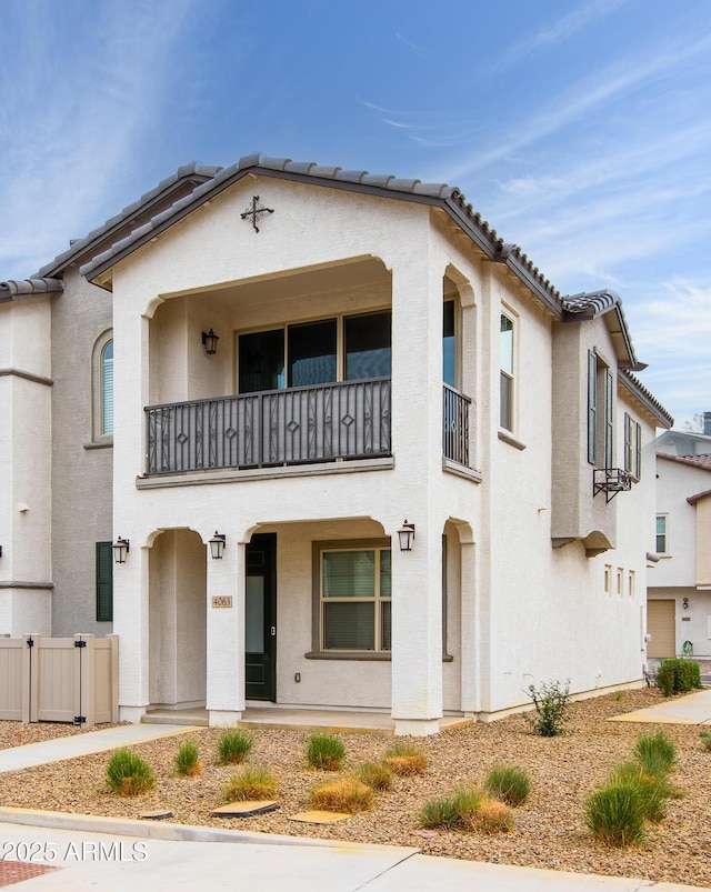 4063 E Amoroso Dr, Gilbert, AZ 85296 - view of front of home with a balcony, a tiled roof, and stucco siding