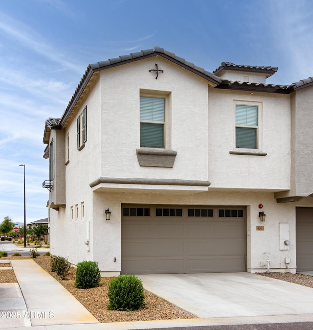 4063 E Amoroso Dr, Gilbert, AZ 85296 - view of property featuring an attached garage, a tiled roof, stucco siding, and concrete driveway