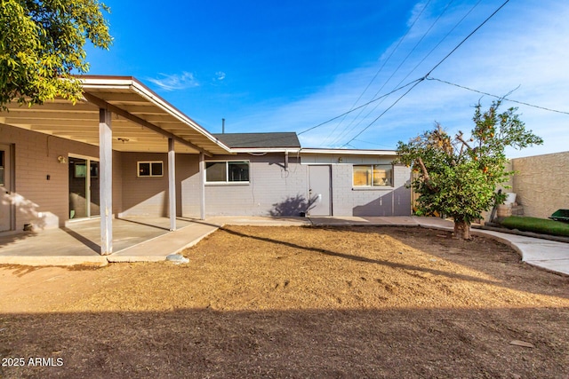 rear view of house featuring a patio