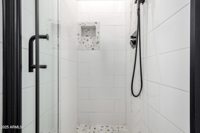 bathroom with a shower with shower door