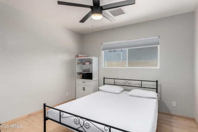 bedroom featuring ceiling fan and light hardwood / wood-style flooring