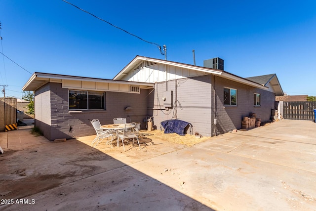 back of house featuring central AC unit and a patio