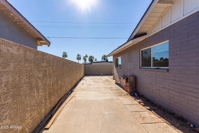 view of side of home with a patio