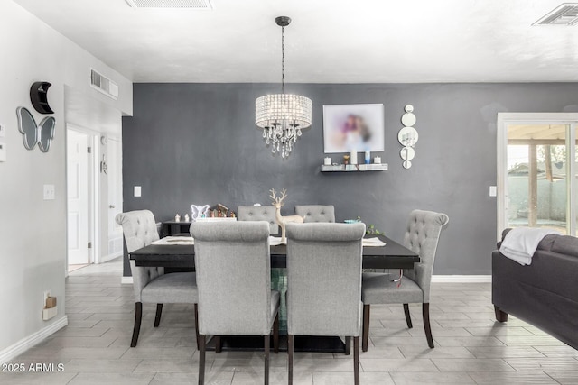 dining space featuring an inviting chandelier