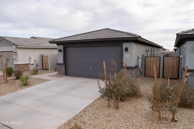 view of front of home featuring a garage and an outdoor structure