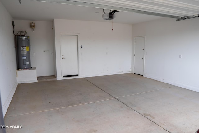 garage featuring a garage door opener and electric water heater