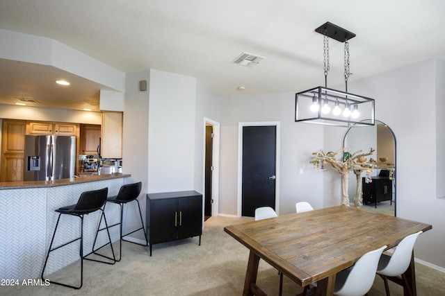 view of carpeted dining area