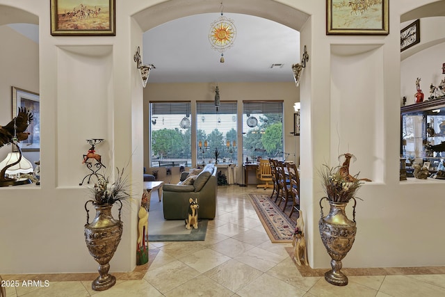 hallway with light tile patterned flooring