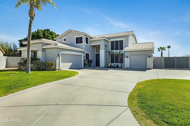 view of front facade with concrete driveway, a tile roof, and fence