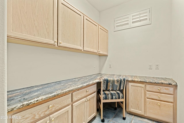 laundry room with light tile patterned floors