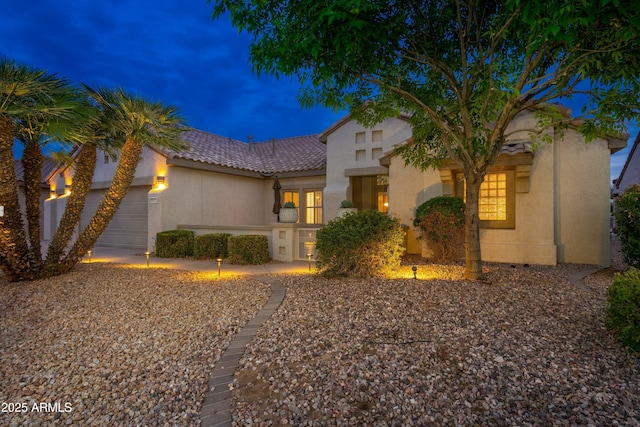 mediterranean / spanish-style house featuring a garage