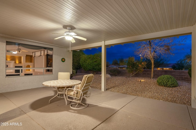 view of patio featuring ceiling fan