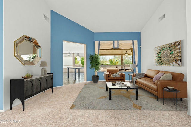 carpeted living room featuring ceiling fan