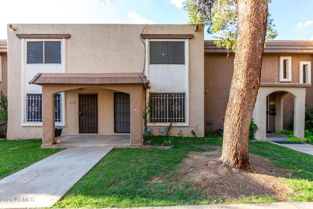 7126 N 19th Ave Unit 228, Phoenix, AZ 85021 - townhome / multi-family property featuring stucco siding and a front lawn