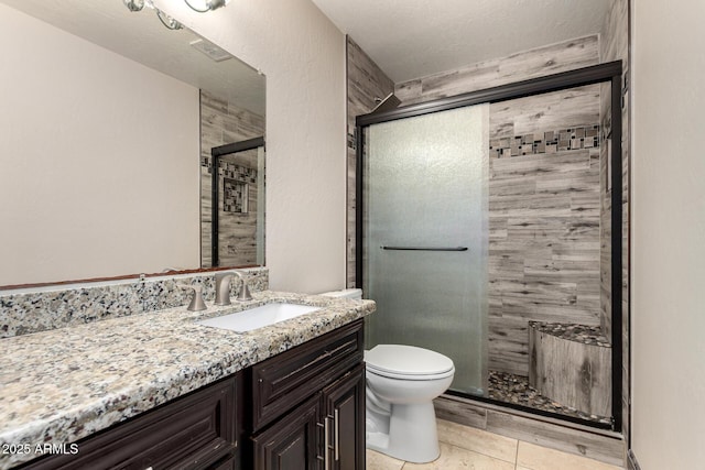 7126 N 19th Ave Unit 228, Phoenix, AZ 85021 - bathroom featuring a stall shower, vanity, and tile patterned floors