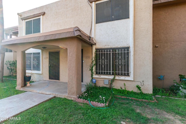 7126 N 19th Ave Unit 228, Phoenix, AZ 85021 - property entrance with stucco siding