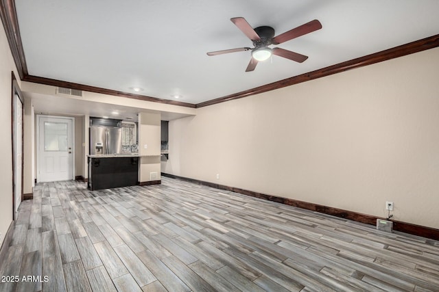 7126 N 19th Ave Unit 228, Phoenix, AZ 85021 - unfurnished living room with crown molding, light wood-style floors, ceiling fan, and recessed lighting